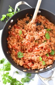 Simple Spanish Rice - Flavored with simple spices and tomatoes, this Simple Spanish Rice recipe is a perfect side dish for any dinner. ~sweetpeasandabcs.com